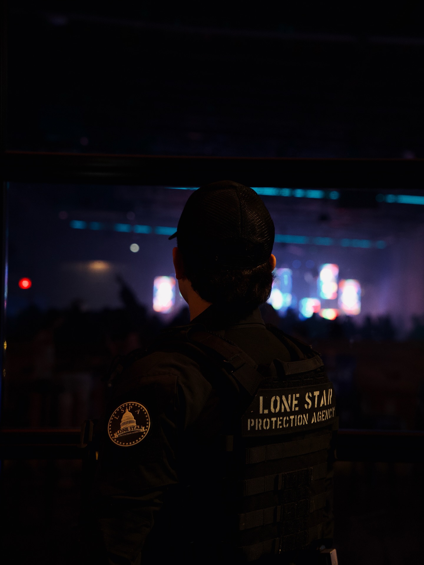 Security guard monitoring Austin cityscape